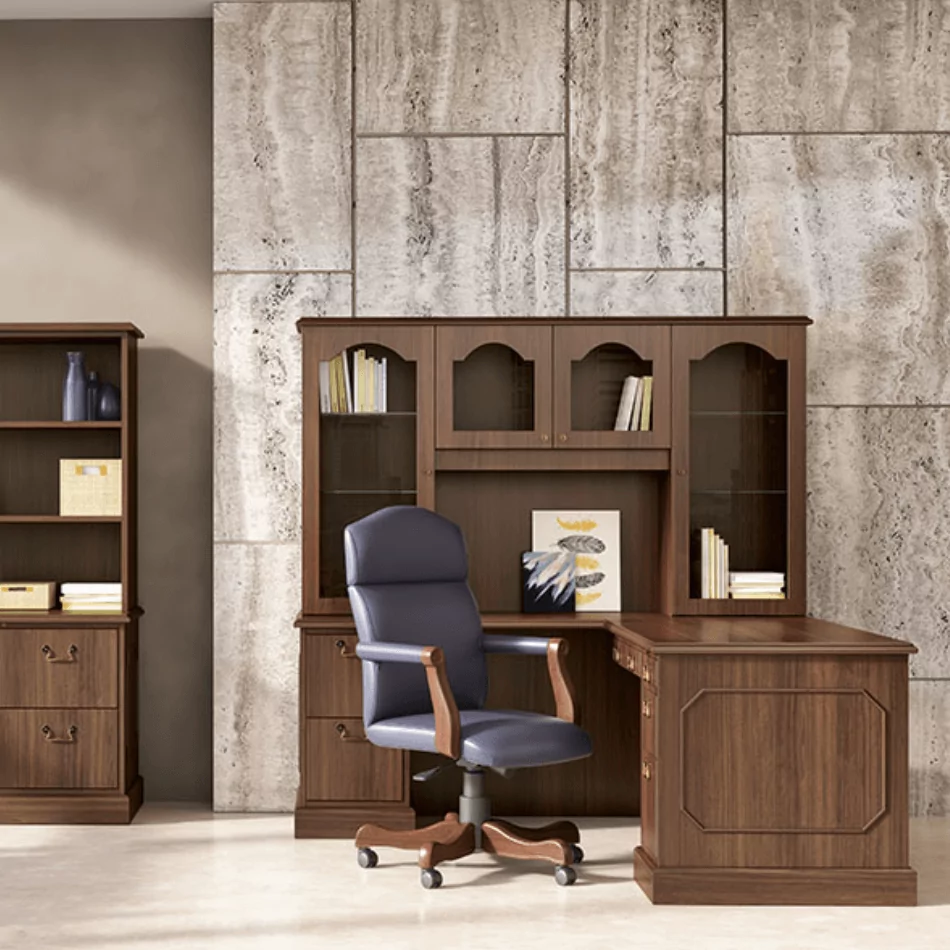 L Shape Desk 7 with a comfortable ergonomic chair in a modern office setting, featuring wooden cabinetry and decorative items on display.
