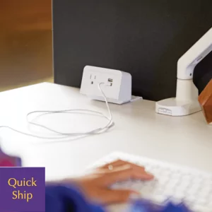 Stand-alone charging solution on a desk with USB ports, featuring a person using a keyboard, emphasizing convenience and functionality for office environments.
