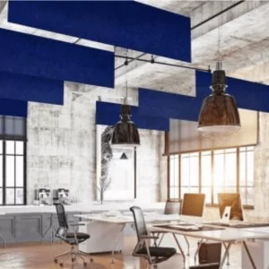 Modern office space featuring acoustic ceiling panels in blue, industrial decor with large windows, pendant lighting, and workstations, illustrating contemporary office design solutions.