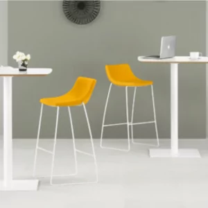 Chirp Cafe lunchroom chairs with vibrant yellow seats beside modern white tables in a stylish café setting, reflecting Furniture Soup's office furniture solutions.