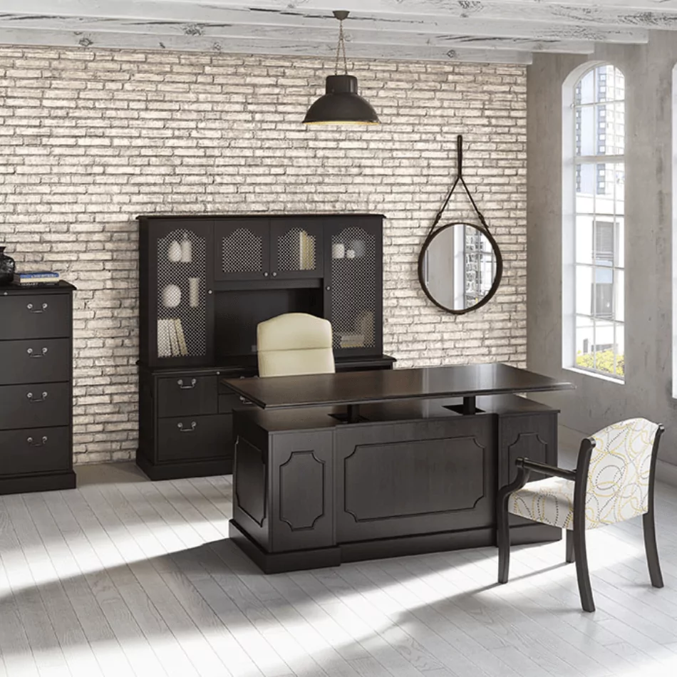 Integrated Height Adjustable Desk 2 in modern office setting with stylish black furniture, including a matching chair and decorative elements.