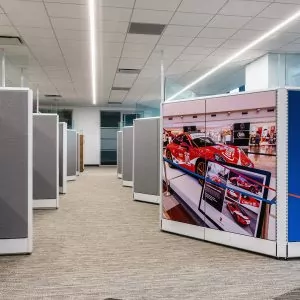 Cubicle layout featuring New Cubicle Global Evolve 11 with vibrant graphics of a red sports car and modern office environment.